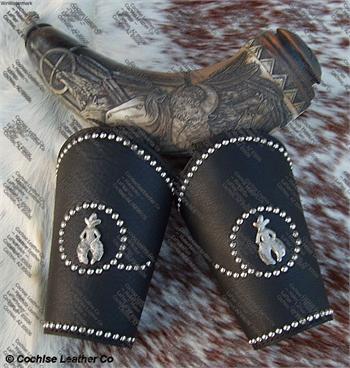 The Cowboy custom western leather wrist cuffs with spots.