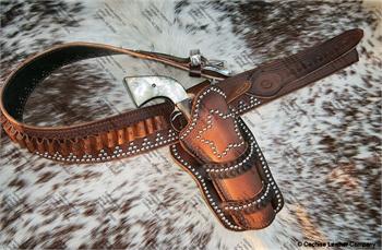 Wild West leather western gunbelt with holster. Border tooled, silver spots and fancy silver buckle, made in USA.